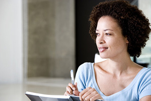 Woman writing in a journal